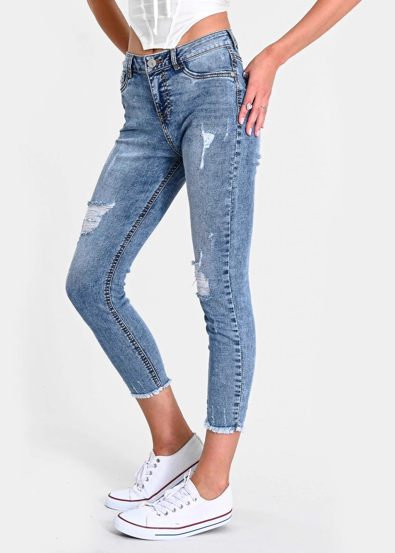 Jeans cintura media destrucciones flecos
