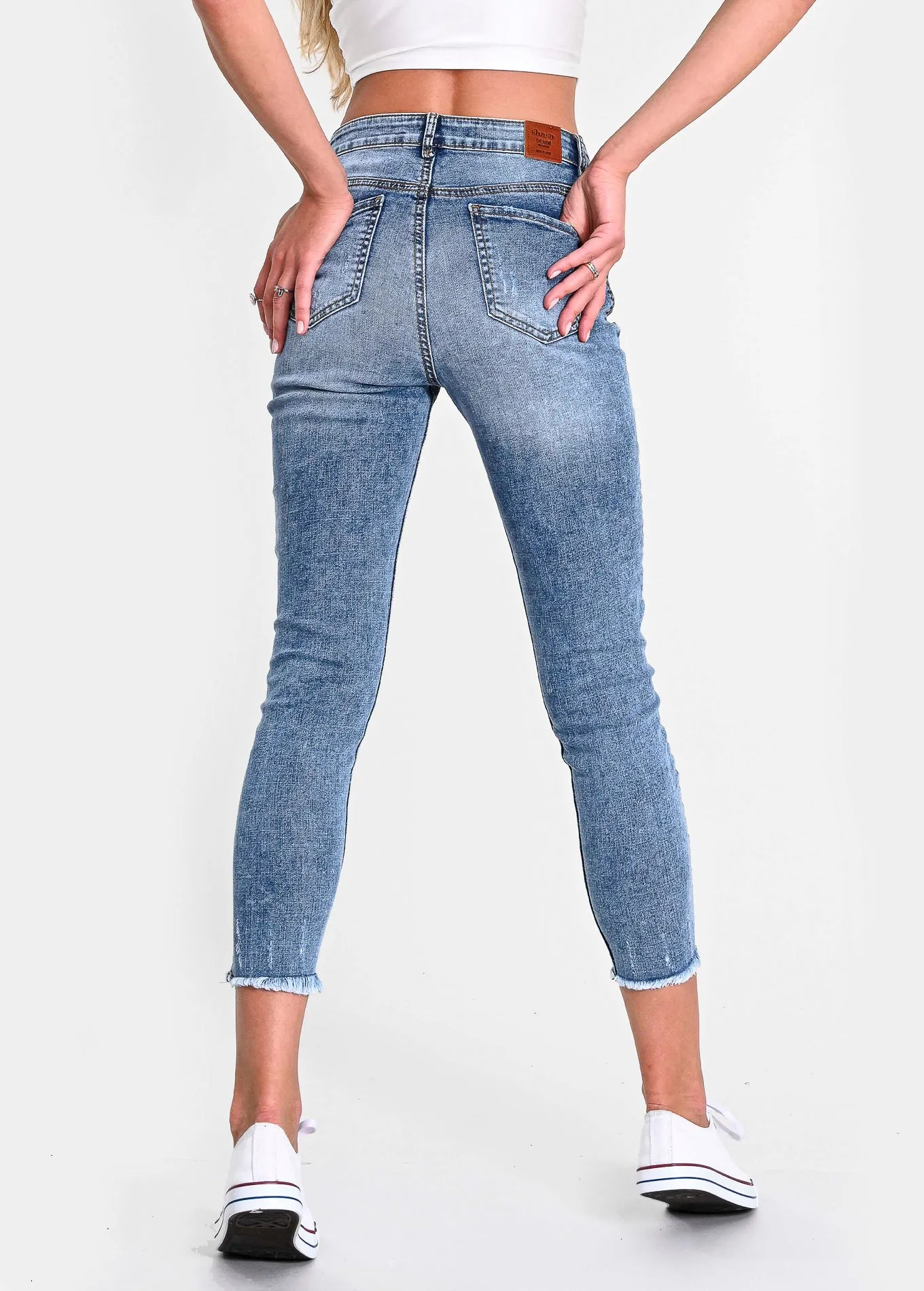 Jeans cintura media destrucciones flecos