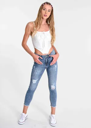 Jeans cintura media destrucciones flecos